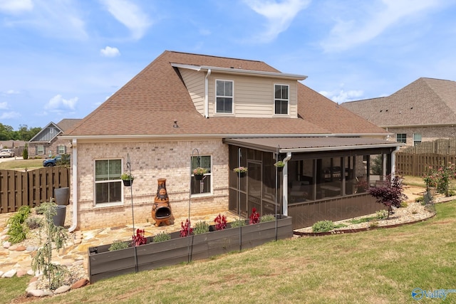 202 Maureen Dr, Madison, AL 35756 - back of house featuring a sunroom, roof with shingles, and brick siding