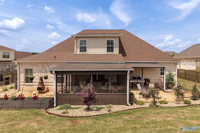 202 Maureen Dr, Madison, AL 35756 - back of house with a sunroom, a patio, roof with shingles, and brick siding