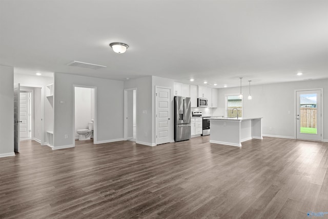 103 Gander Cir, Owens Cross Roads, AL 35763 - unfurnished living room with recessed lighting and dark wood-type flooring