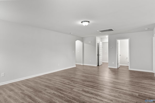 103 Gander Cir, Owens Cross Roads, AL 35763 - unfurnished room with arched walkways and dark wood-style floors