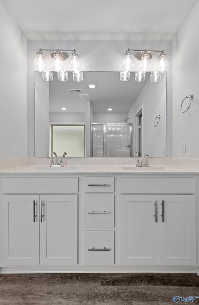 103 Gander Cir, Owens Cross Roads, AL 35763 - bathroom with double vanity and a shower stall