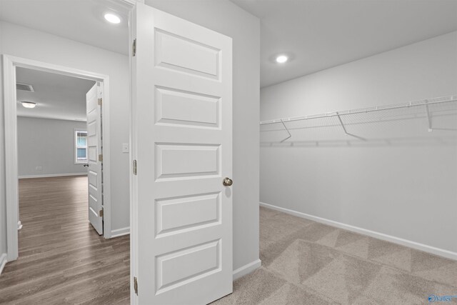 103 Gander Cir, Owens Cross Roads, AL 35763 - spacious closet featuring wood finished floors