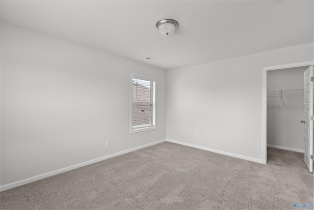 103 Gander Cir, Owens Cross Roads, AL 35763 - unfurnished bedroom featuring carpet, a spacious closet, and a closet