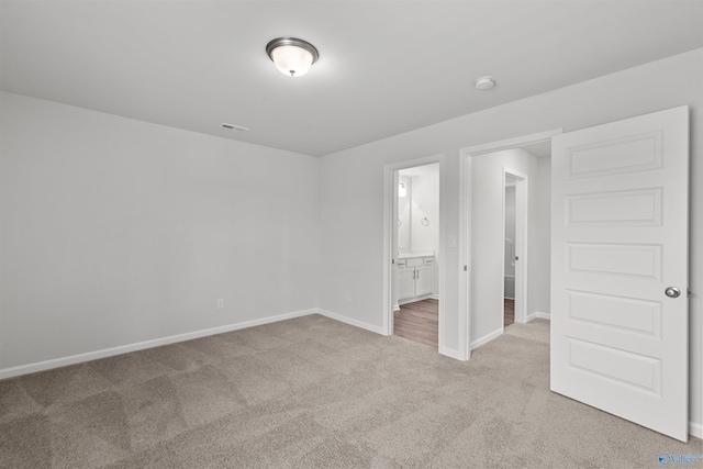 103 Gander Cir, Owens Cross Roads, AL 35763 - unfurnished bedroom featuring light colored carpet and ensuite bathroom