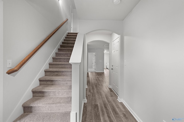 103 Gander Cir, Owens Cross Roads, AL 35763 - stairs featuring arched walkways and wood finished floors