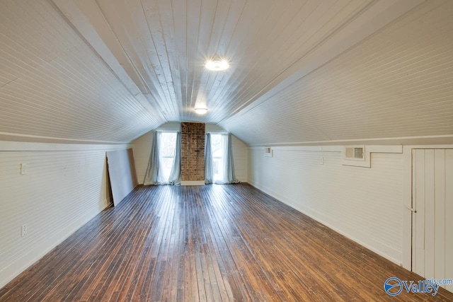 additional living space featuring lofted ceiling, dark wood-type flooring, and wooden ceiling