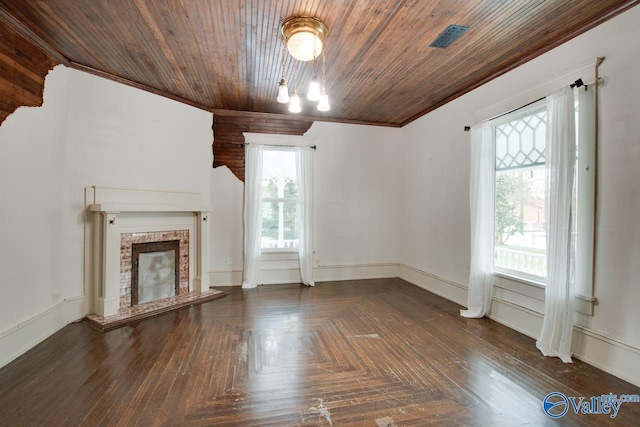 unfurnished living room with dark parquet flooring and wooden ceiling