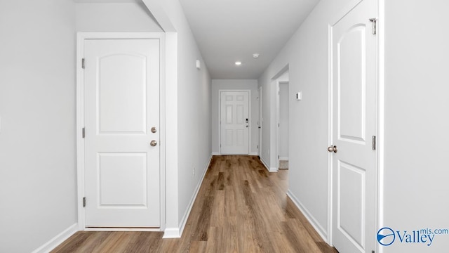 hallway featuring light wood-type flooring