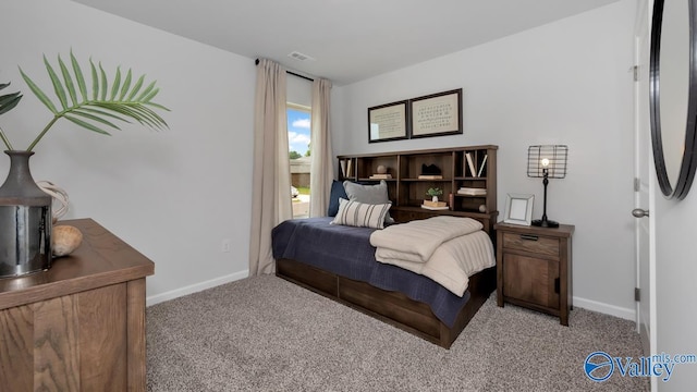 bedroom with light colored carpet