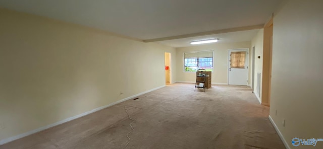 empty room featuring light colored carpet