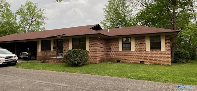 single story home featuring a carport and a front lawn