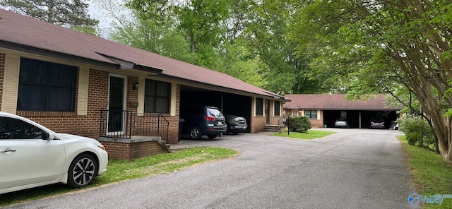 view of front of property featuring a carport