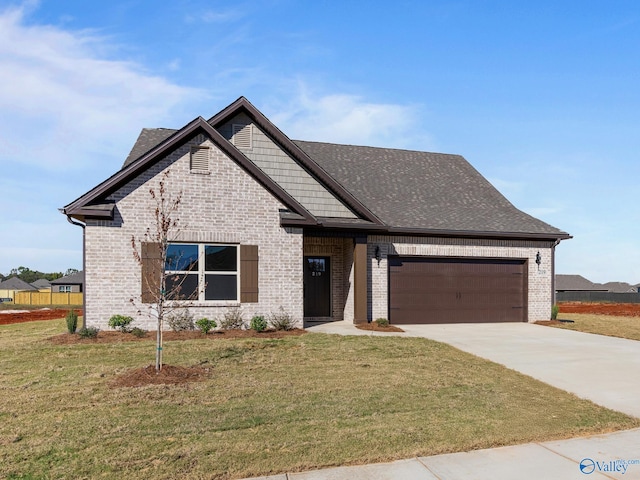 view of front facade with a front lawn and a garage