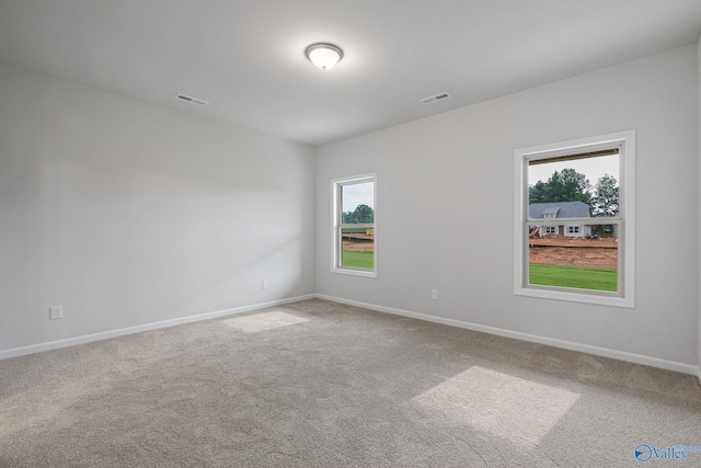 empty room featuring carpet flooring