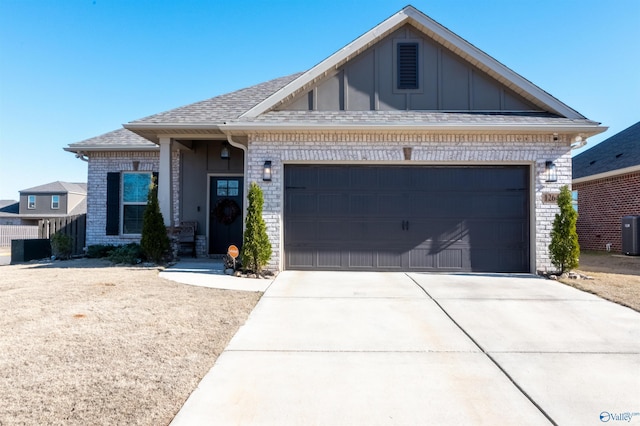 view of front of home with cooling unit and a garage