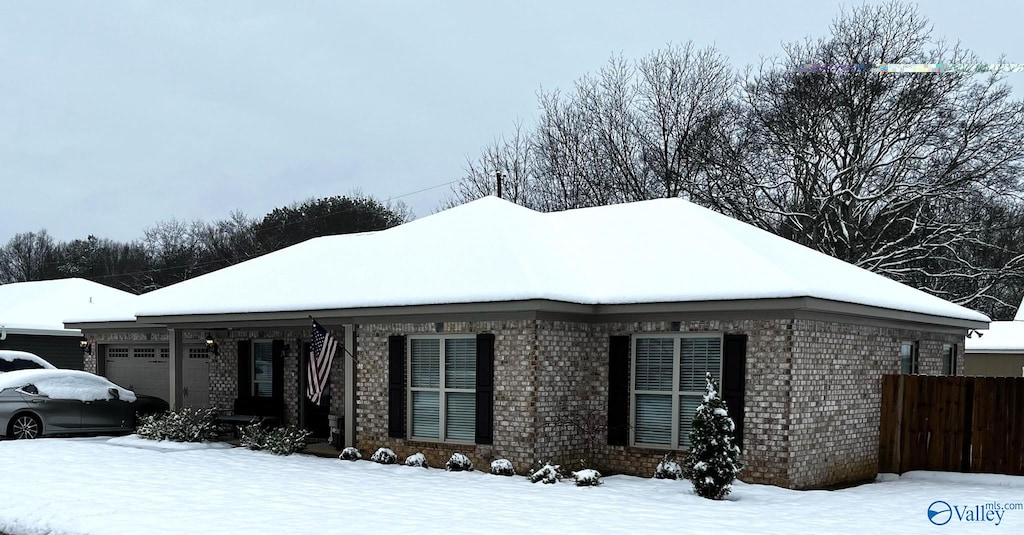 103 Prospect Dr SW, Hartselle, AL 35640 - view of snowy exterior with a garage