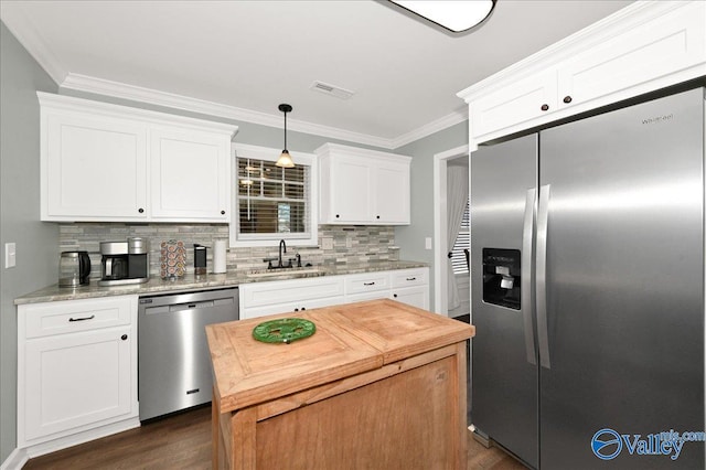 kitchen featuring sink, white cabinetry, and appliances with stainless steel finishes