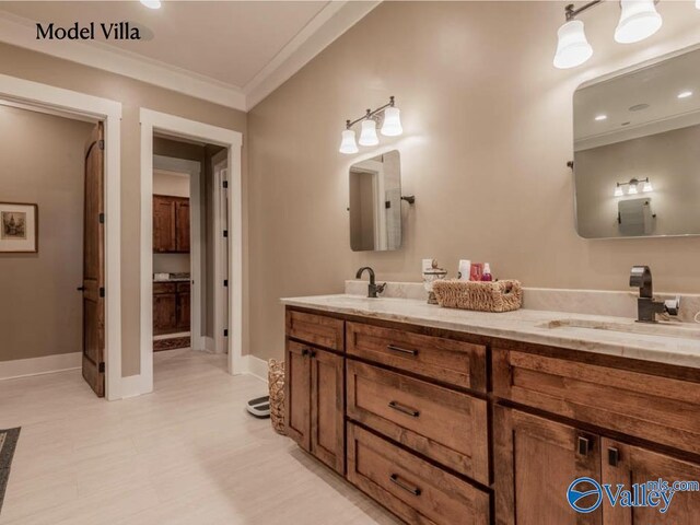 bathroom featuring double vanity, tile patterned floors, and ornamental molding