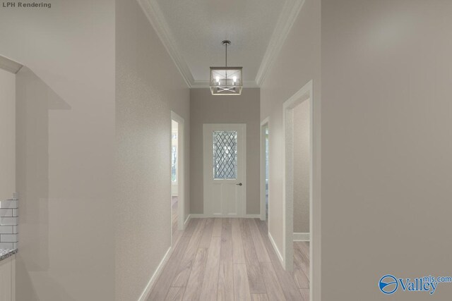 interior space featuring an inviting chandelier, light wood-type flooring, baseboards, and ornamental molding