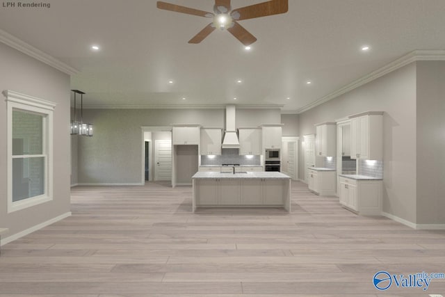 kitchen with built in microwave, white cabinetry, crown molding, wall chimney range hood, and light wood-type flooring