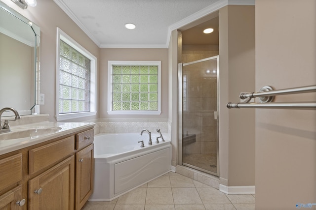 302 Cherry St NW, Hartselle, AL 35640 - bathroom featuring vanity, a garden tub, a stall shower, tile patterned flooring, and ornamental molding
