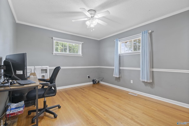 302 Cherry St NW, Hartselle, AL 35640 - office space featuring healthy amount of natural light, a ceiling fan, wood finished floors, a textured ceiling, and ornamental molding