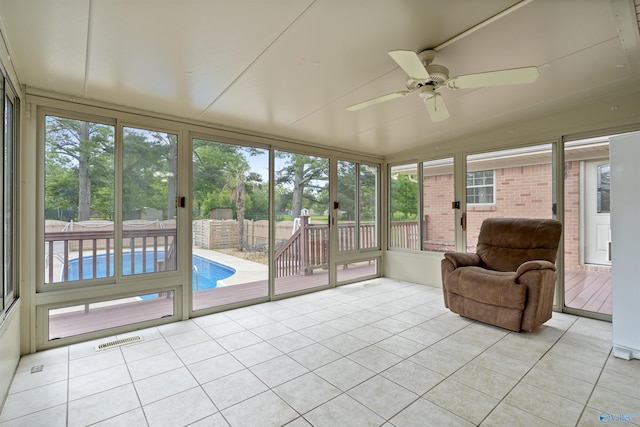 302 Cherry St NW, Hartselle, AL 35640 - sunroom with ceiling fan, vaulted ceiling, and healthy amount of natural light