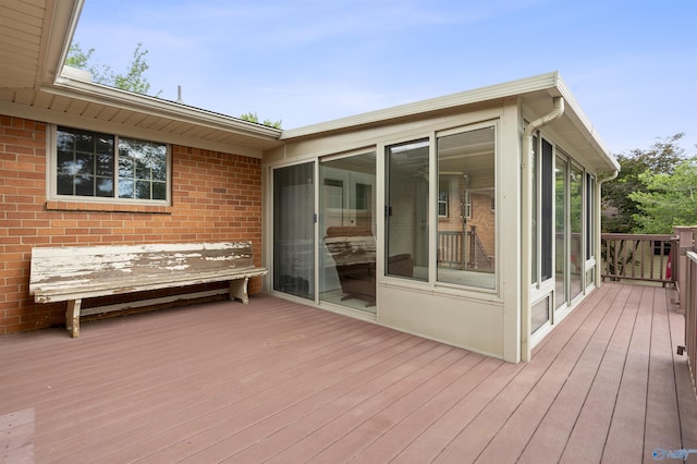 302 Cherry St NW, Hartselle, AL 35640 - wooden deck featuring a sunroom