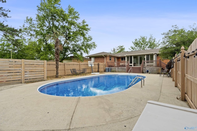302 Cherry St NW, Hartselle, AL 35640 - view of pool with a deck, a fenced backyard, a sunroom, and a patio area