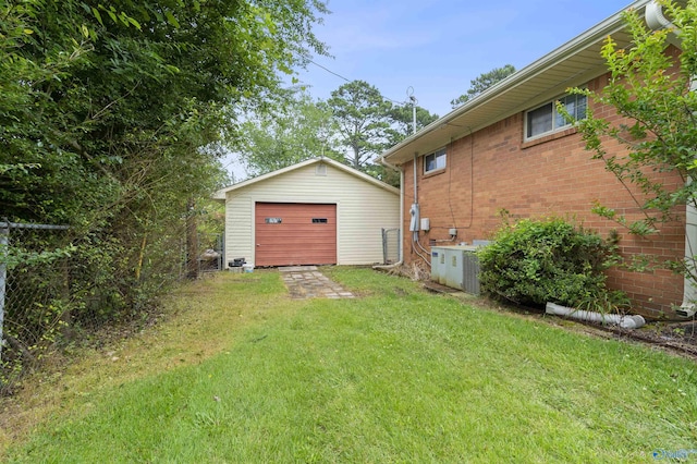 302 Cherry St NW, Hartselle, AL 35640 - view of green lawn with a garage and an outbuilding