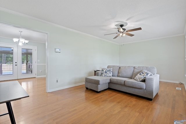 302 Cherry St NW, Hartselle, AL 35640 - living area with a ceiling fan, light wood finished floors, crown molding, and a chandelier