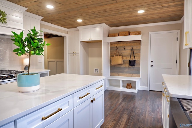 mudroom with dark hardwood / wood-style flooring, ornamental molding, and wooden ceiling