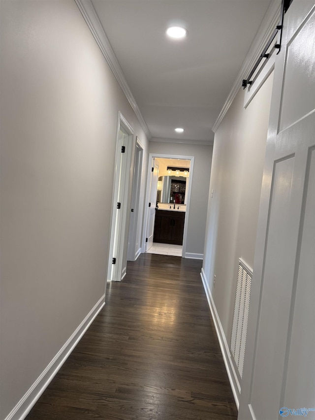 hall with crown molding and dark wood-type flooring