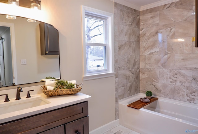 bathroom with vanity, crown molding, and a bath