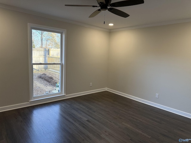 empty room featuring ornamental molding, dark hardwood / wood-style floors, and ceiling fan