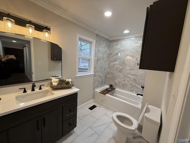 full bathroom with tiled shower / bath, vanity, toilet, and ornamental molding