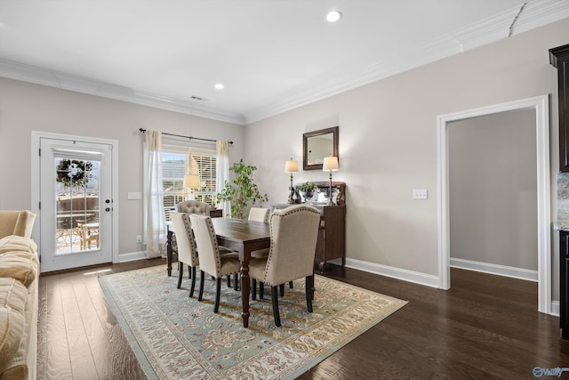 dining area with ornamental molding, dark wood-type flooring, recessed lighting, and baseboards