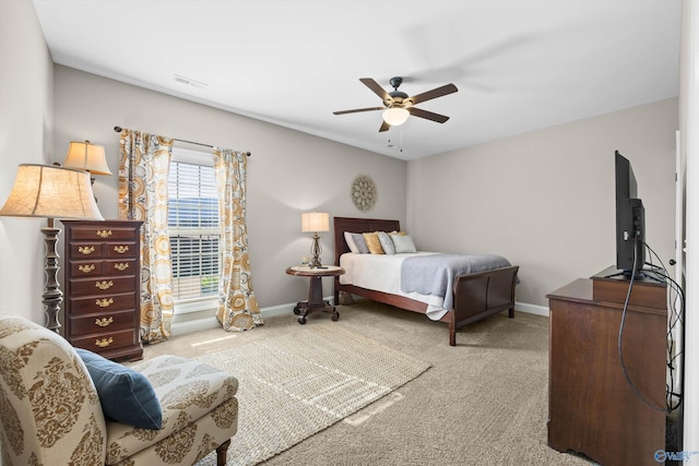 bedroom featuring a ceiling fan, carpet, visible vents, and baseboards