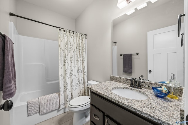 bathroom with toilet, vanity, shower / bath combo with shower curtain, and tile patterned floors