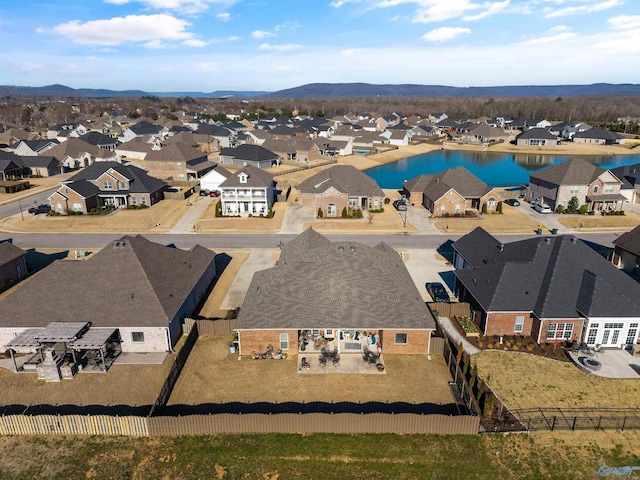 birds eye view of property featuring a residential view and a water and mountain view