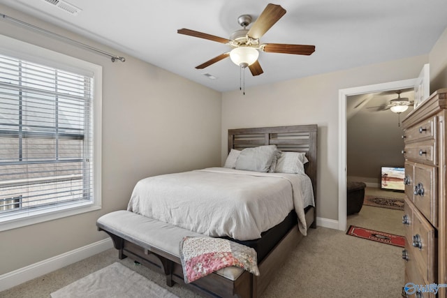 bedroom featuring light carpet and ceiling fan