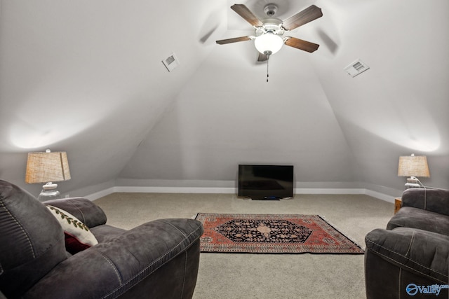 carpeted living room featuring ceiling fan and vaulted ceiling