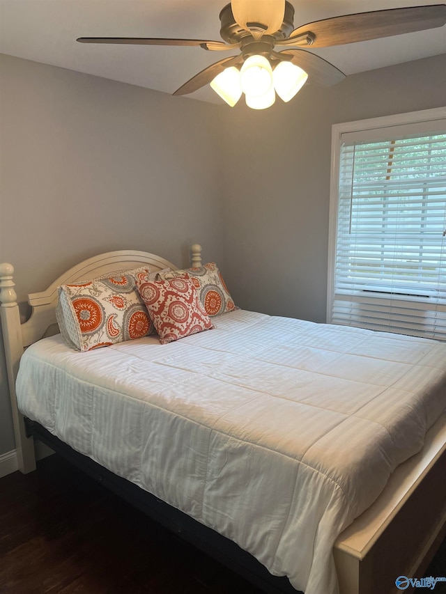 bedroom featuring ceiling fan and wood-type flooring