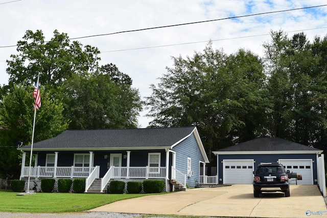 view of front of house with a garage, covered porch, and a front lawn