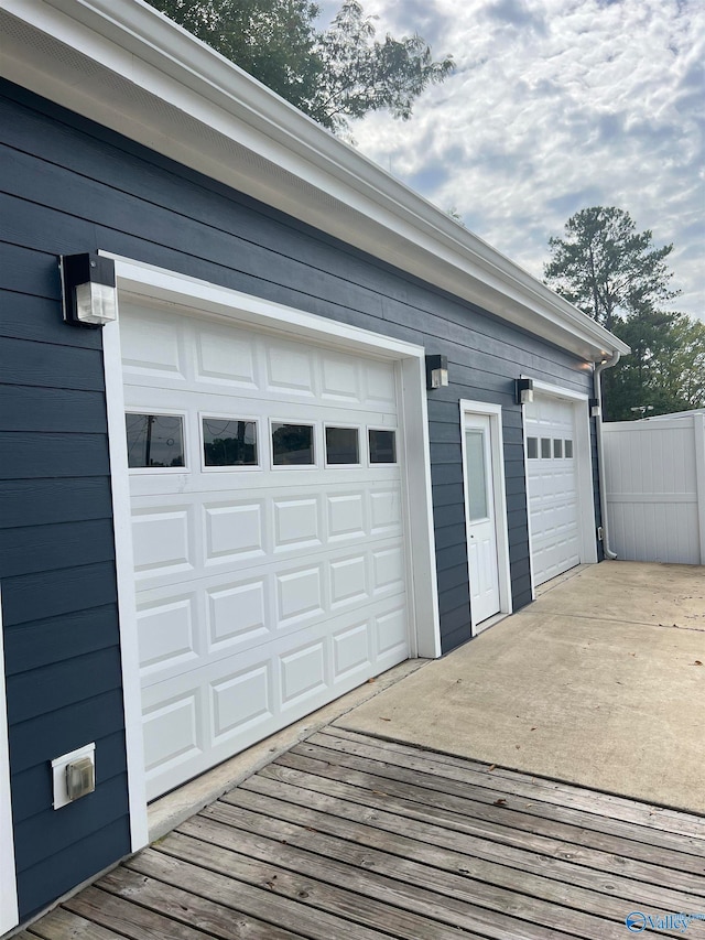 garage featuring wood walls