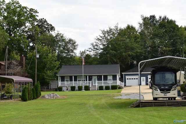 rear view of property with a yard, covered porch, a carport, and a garage