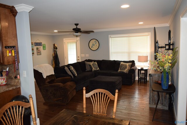 living room featuring ceiling fan, dark hardwood / wood-style flooring, and ornamental molding