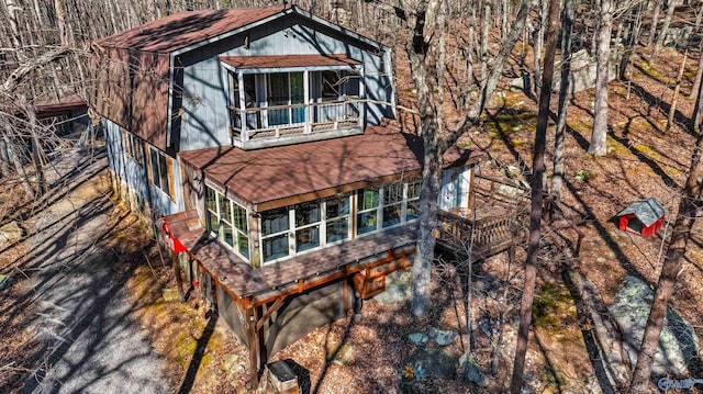 rear view of house featuring a balcony