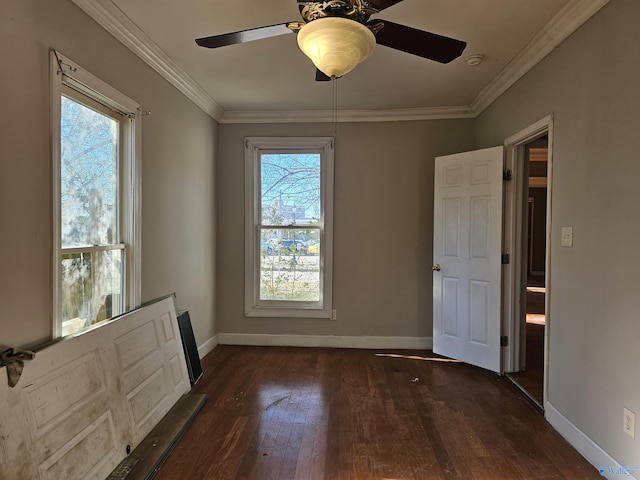 unfurnished room featuring ceiling fan, dark hardwood / wood-style floors, and ornamental molding