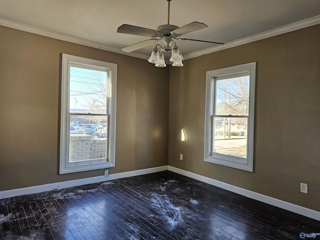 spare room featuring ceiling fan, dark hardwood / wood-style floors, and ornamental molding